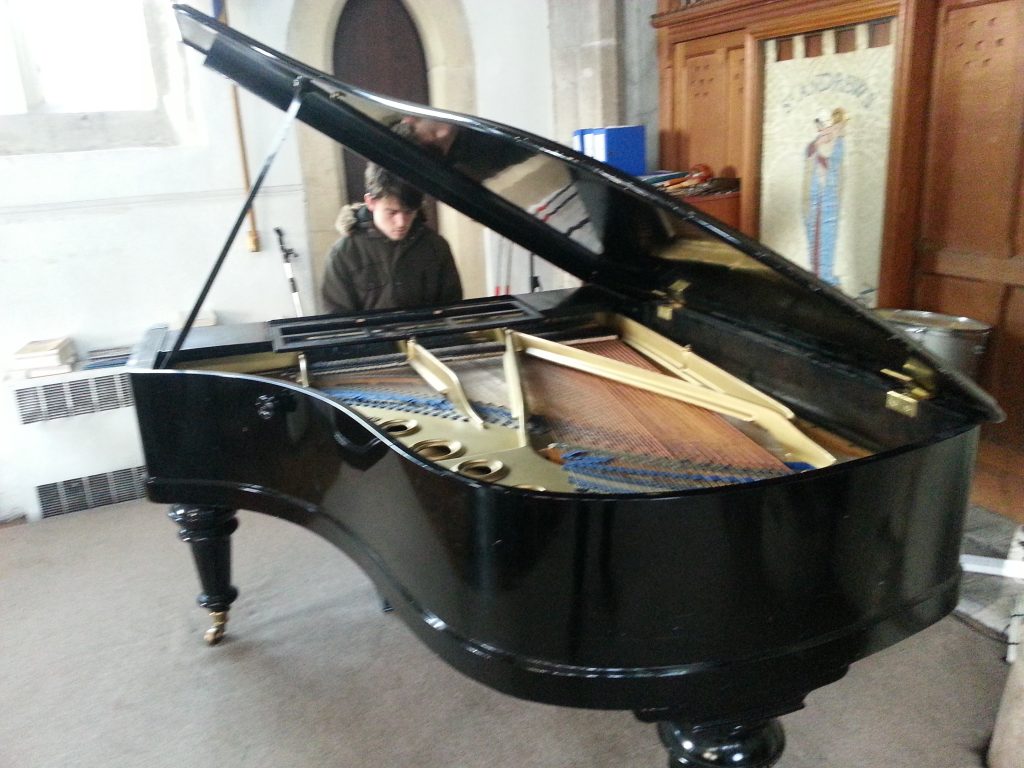 Picture of grand piano being played by max dedman in st andrews church alan dedman basil george dedman obituary
