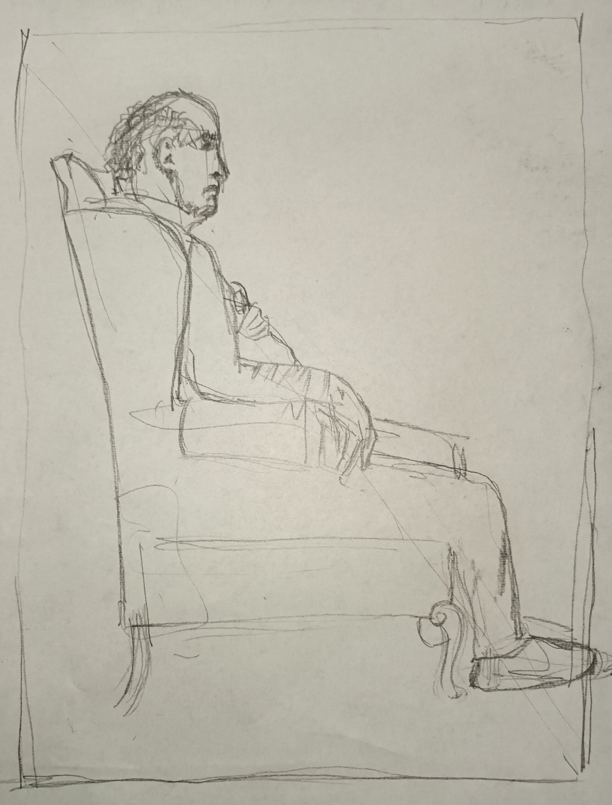 Stephen in armchair drawing the word